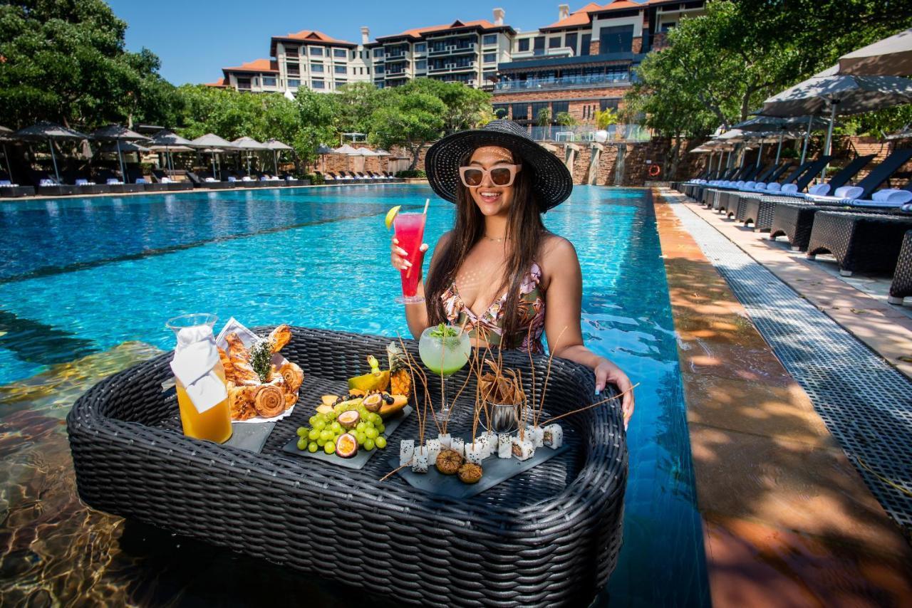 Hotel The Capital Zimbali Ballito Exterior foto Poolside at the hotel