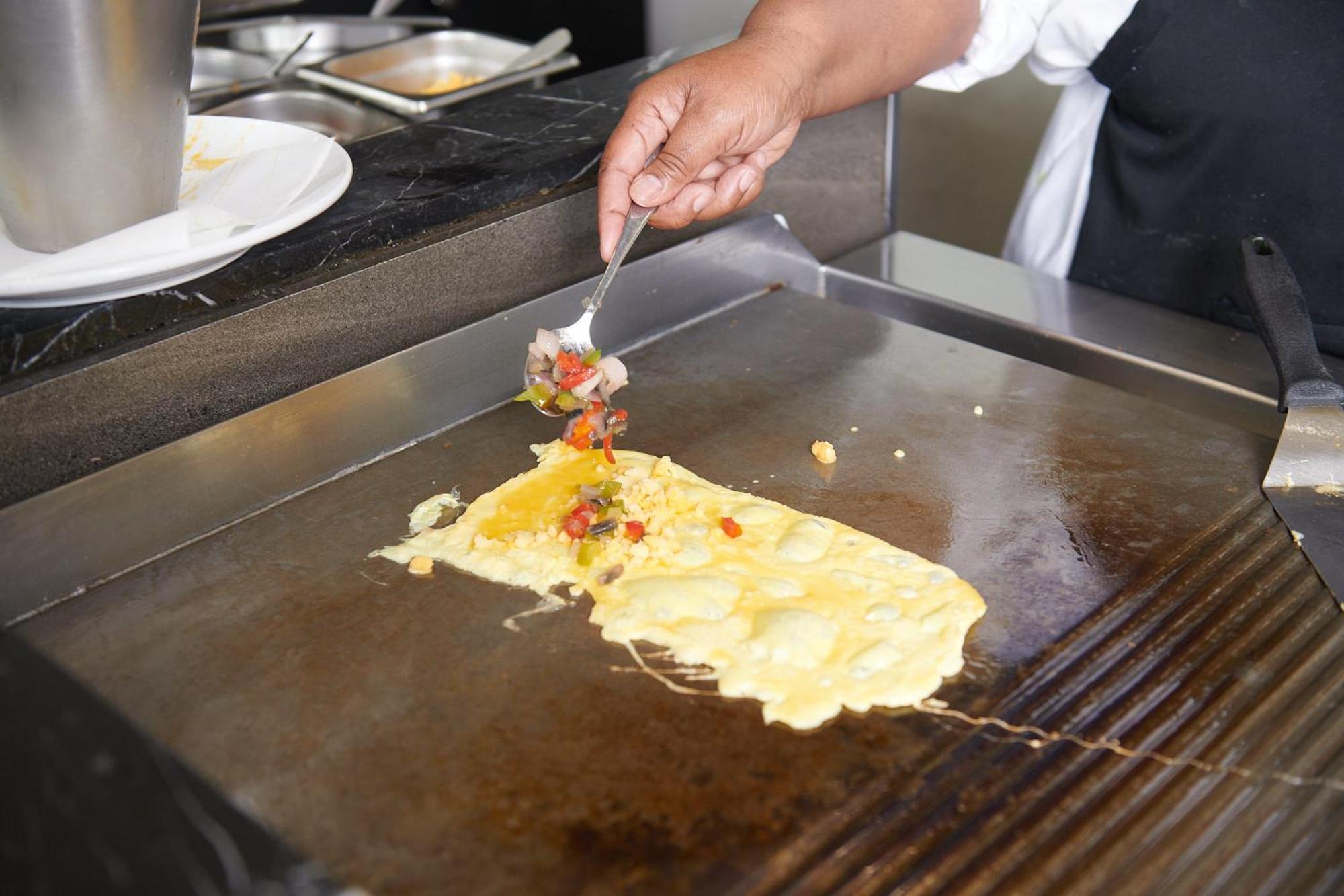 Hotel The Capital Zimbali Ballito Exterior foto Preparation of an omelette